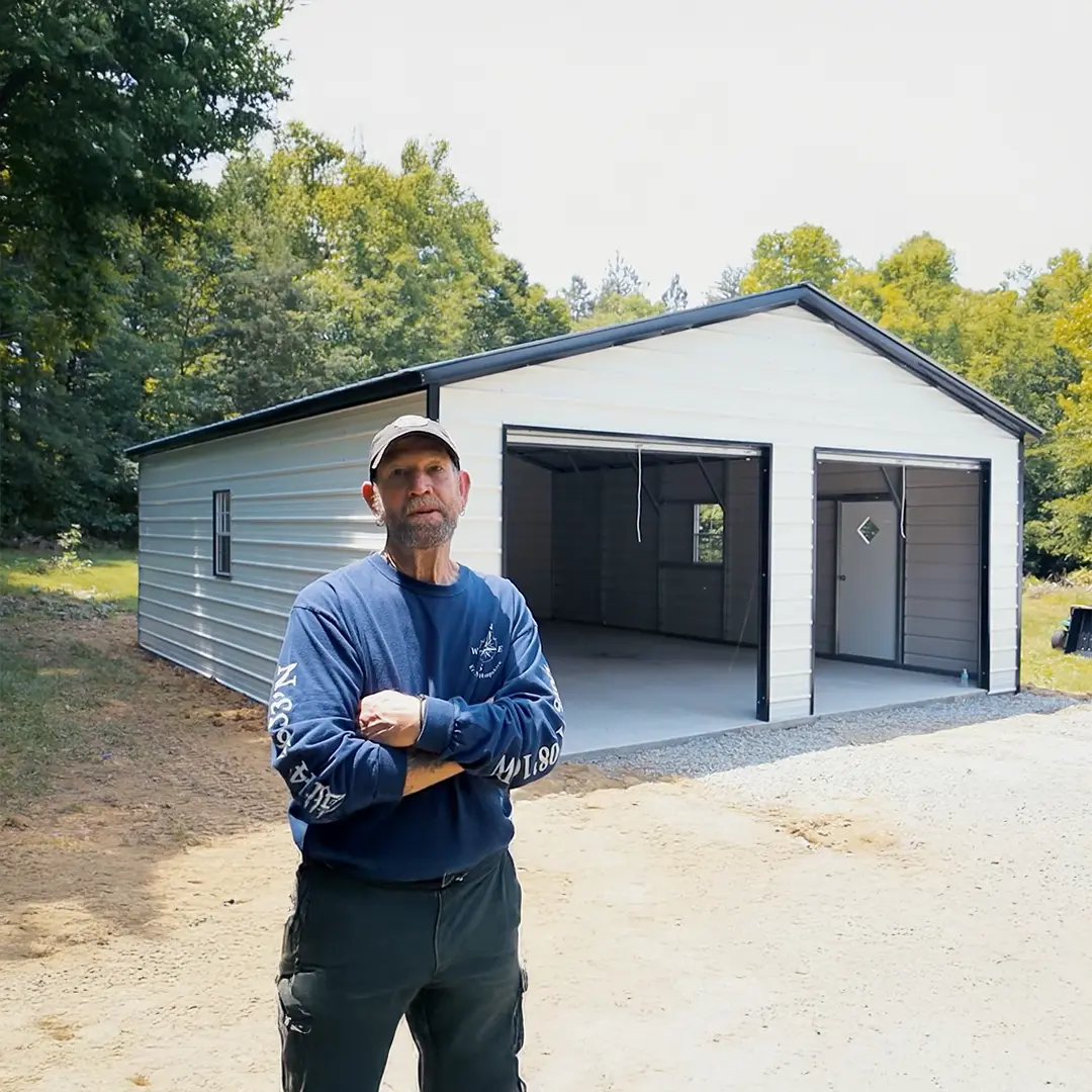 customer standing in front of a 24x30x9 Metal Garage